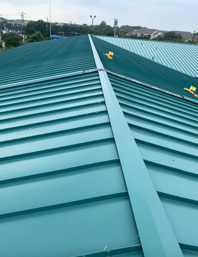 Green commercial metal roof ridge and valley for Metal Roof Repair in Monson