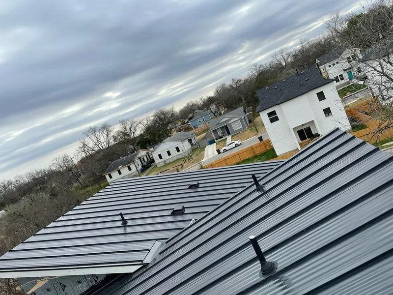 Standing seam metal roof panels with vents for Skylight Repair in Monson